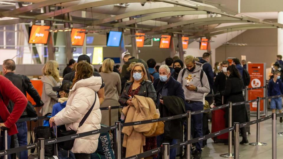 SYDNEY, AUSTRALIA - NewsWire Photos JUNE 09, 2022: Travellers and airport staff are pictured at Sydney International Airport with increased overseas travel causing chaos for DFAT in processing passport applications. Picture: NCA NewsWire / Seb Haggett