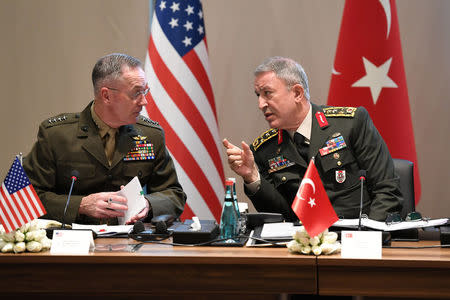 Turkey's Chief of Staff General Hulusi Akar chats with U.S. Chairman of the Joint Chiefs of Staff Joseph Dunford during a meeting in Antalya, Turkey March 7, 2017. Turkish Military/Handout via REUTERS