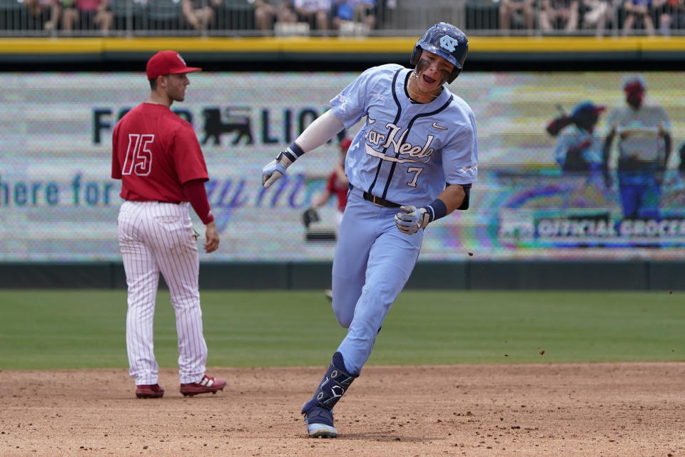 North Carolina's Vance Honeycutt rounds the bases after a three-run home run against the NC State during the second inning in an NCAA college baseball game at the Atlantic Coast Conference tournament final Sunday, May 29, 2022, in Charlotte, N.C. (AP Photo/Chris Carlson)