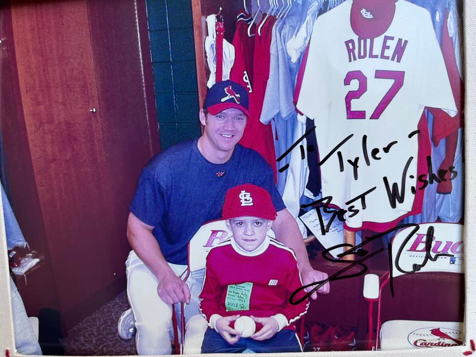 Tyler Frenzel with Scott Rolen in the St. Louis Cardinals locker room.