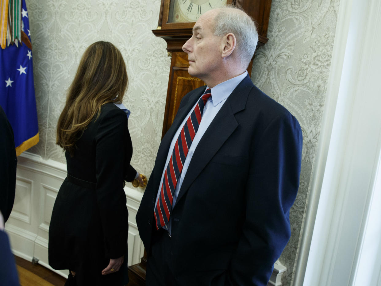 John Kelly listens during a meeting in the Oval Office: AP Photo/Evan Vucci