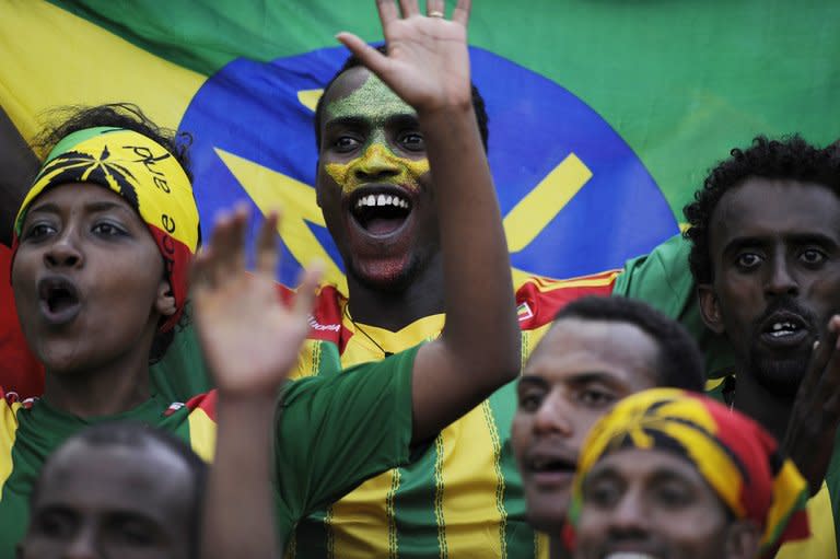 Ethiopia's supporters celebrate after Ethiopia's first goal during the 2014 FIFA World Cup qualifying football match Ethiopia vs South Africa on June 16, 2013 in Addis Ababa