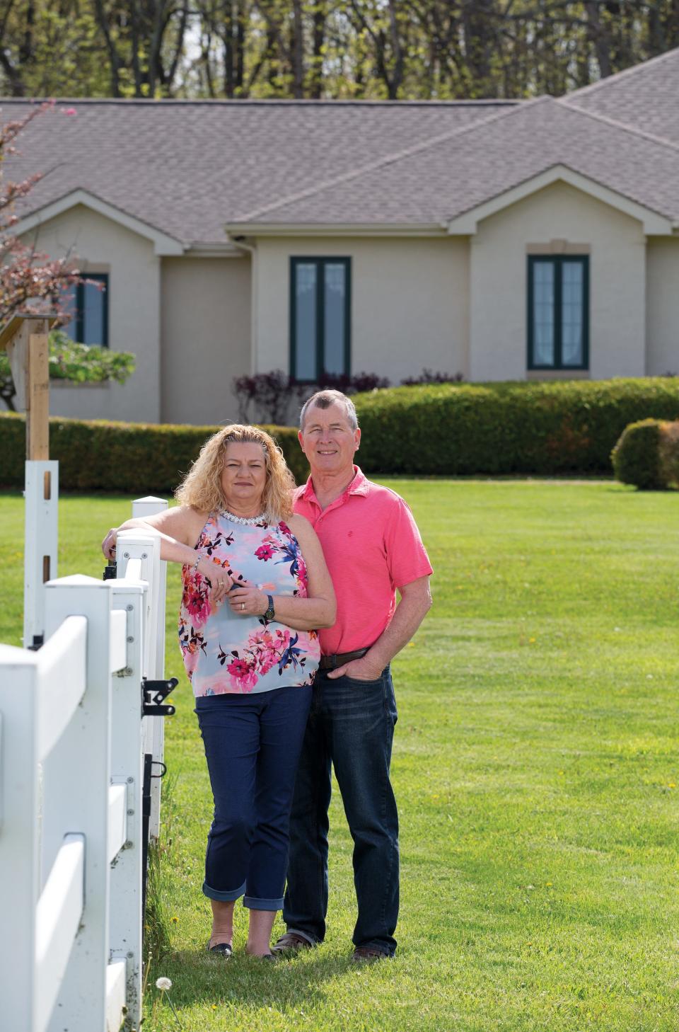 Vicki and Ray Rusmisel outside their new home