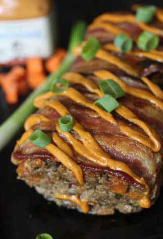 <p>Topping this meatloaf with chipotle mayo, green onions, and bacon means every bite is bursting with flavor.</p><p><strong>Get the recipe at <a rel="nofollow noopener" href="http://paleomg.com/bacon-chorizo-chipotle-smothered-meatloaf/" target="_blank" data-ylk="slk:PaelOMG" class="link ">PaelOMG</a>.</strong></p>
