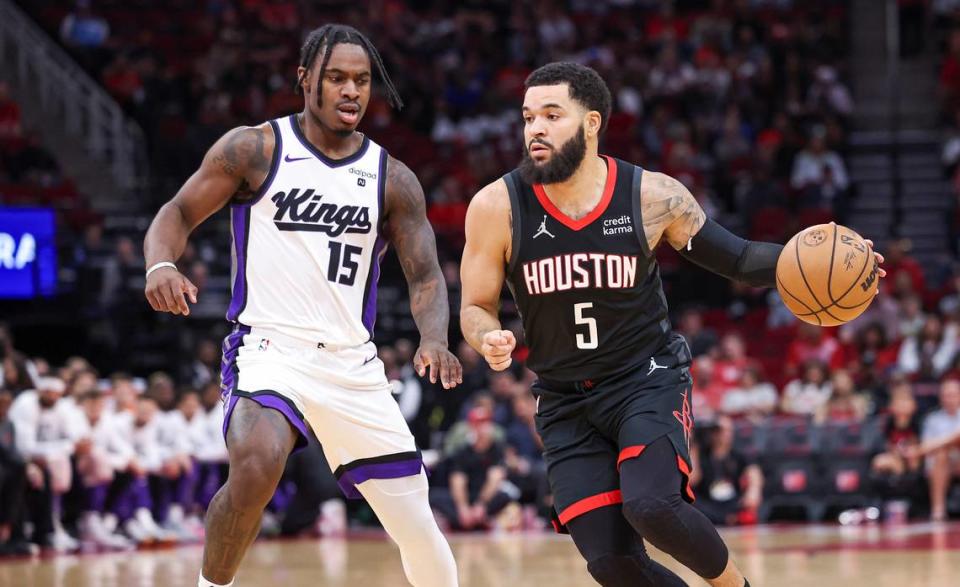 Houston Rockets guard Fred VanVleet (5) dribbles the ball as Sacramento Kings guard Davion Mitchell (15) defends during the first quarter Saturday, Nov. 4, 2023, at Toyota Center in Houston, Texas.