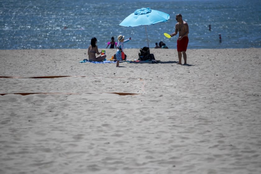 VENTURA, CA - MAY 02: Beaches including Harbor Cove Beach were open but beachgoers were not supposed to be sitting on the sand on Saturday, May 2, 2020 in Ventura, CA. (Brian van der Brug / Los Angeles Times)