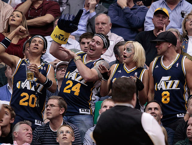 Utah Jazz fans trade fours. (Getty Images)