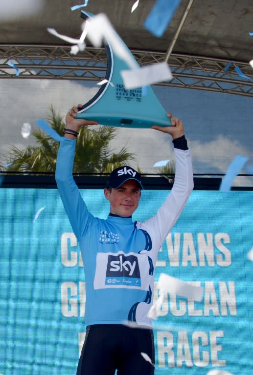 Britain's Peter Kennaugh of Team Sky holds up the trophy on the podium after winning the men's elite cycling race in the 2016 Cadel Evans Great Ocean Road Race