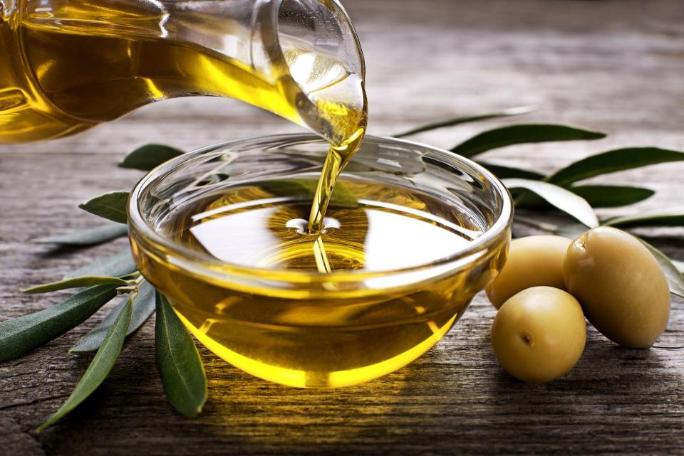 <p>Olive oil is packed with heart-healthy monounsaturated fats (MUFAs), which help lower "bad" LDL cholesterol and raise "good" HDL cholesterol. It’s rich in antioxidants that can help reduce the risk of cancer and other chronic diseases, like Alzheimer’s. Look for extra-virgin oils for the most antioxidants and flavor. Drizzle small amounts on veggies before roasting; use it to sauté or stir-fry, in dressings and marinades, and to flavor bread at dinner in lieu of a layer of butter or margarine.</p><p><strong>Try it: </strong><a href="https://www.prevention.com/food-nutrition/recipes/a25670258/baked-halibut-recipe/" rel="nofollow noopener" target="_blank" data-ylk="slk:Baked Halibut With Roasted Potatoes and Brussels Sprouts;elm:context_link;itc:0;sec:content-canvas" class="link ">Baked Halibut With Roasted Potatoes and Brussels Sprouts</a></p>