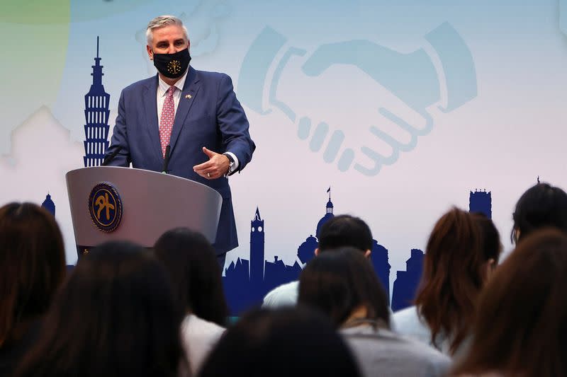 Indiana Governor Eric Holcomb answers questions from the press in Taipei