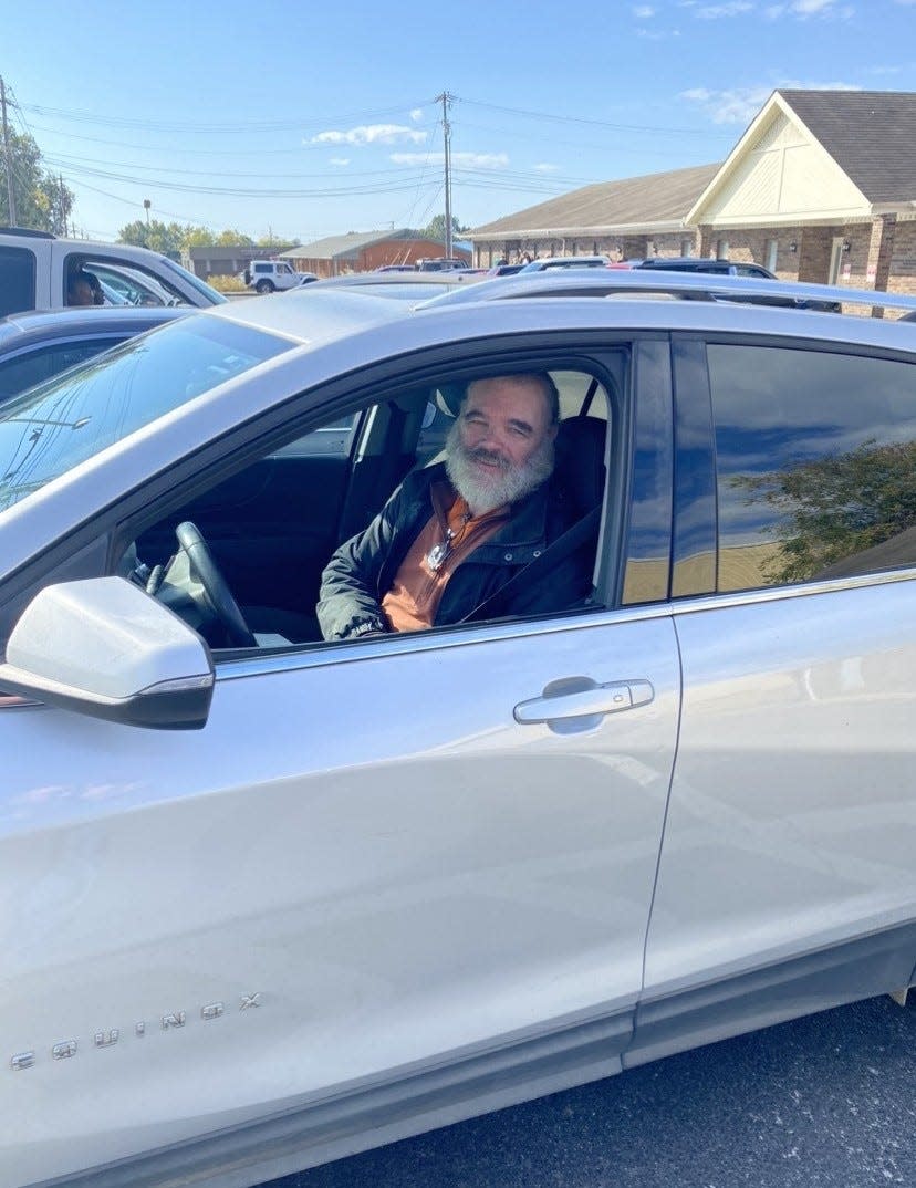 Ernest Chandler with the vehicle he received from the Jacob Bradley Dugger Foundation on Oct. 20, 2023.