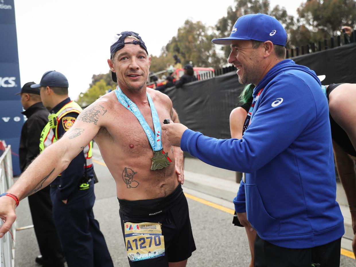 Diplo is interviewed after finishing the Los Angeles Marathon on March 19 in Los Angeles, California