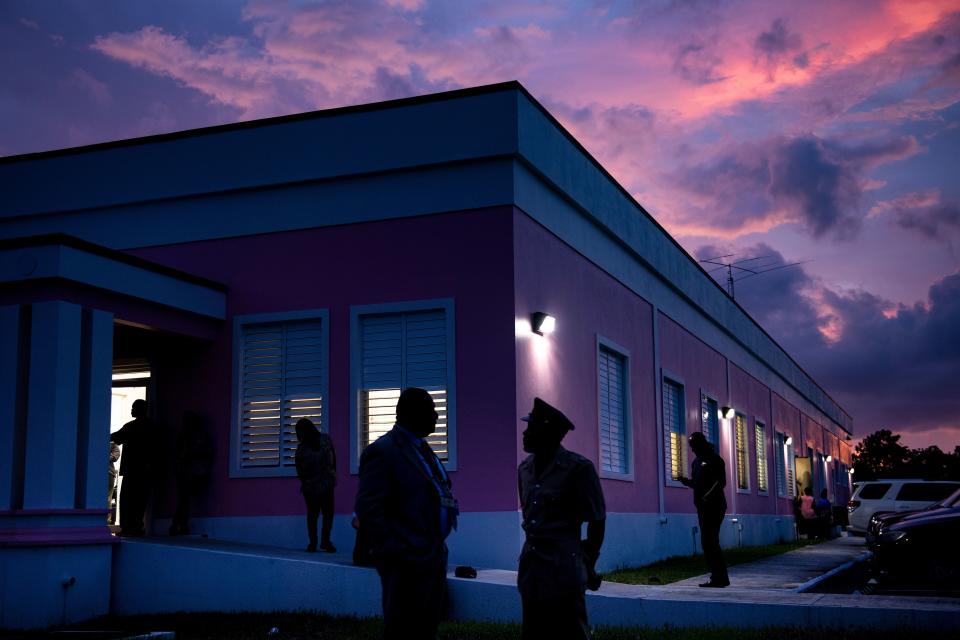 People talk outside the National Emergence Managment Agency while waiting for an update regarding Hurricane Dorian on Sept. 3, 2019, in Nassau, New Providence. (Photo: Brendan Smialowski/AFP/Getty Images)