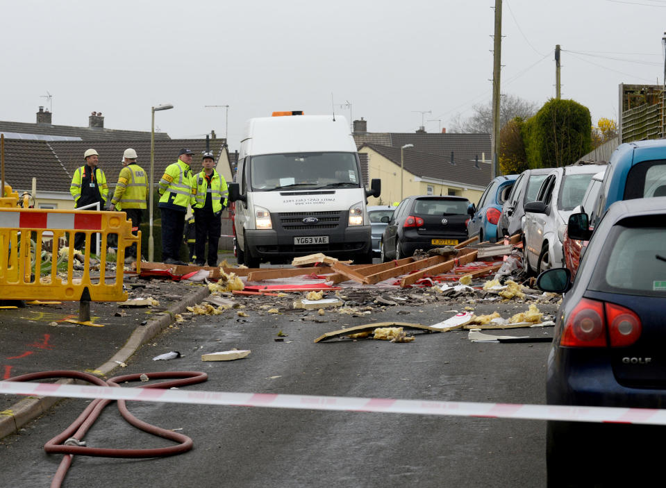 A neighbour helped to rescue the woman from her bungalow. (SWNS)