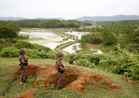 Members of Border Guard Bangladesh (BGB) stand watch at the Ghumdhum point on Bangladesh-Myanmar border in Cox’s Bazar, Bangladesh, August 26, 2017. REUTERS/Mohammad Ponir Hossain