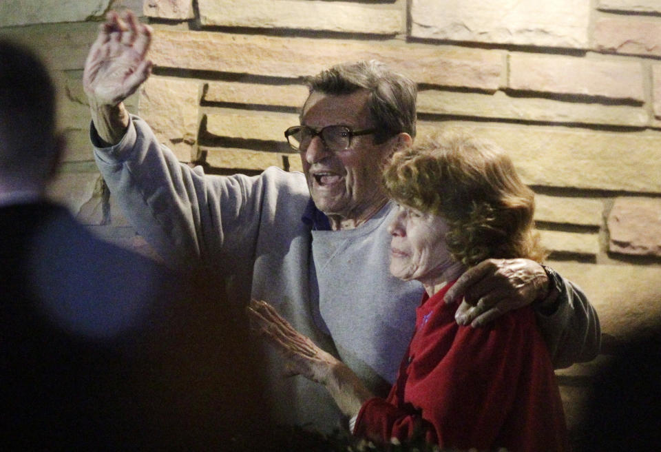 FILE - In this Nov. 9, 2011 file photo, former Penn State Coach Joe Paterno and his wife, Sue Paterno, stand on their porch to thank supporters gathered outside their home in State College, Pa. Joe Paterno earned a state pension of $13.4 million for his 61-year coaching career at Penn State. Paterno's family announced Tuesday, May 22, 2012, through a spokesman that Paterno's widow, Sue, would receive an initial payment of $10.1 million by the end of May, with the rest to be paid out over the next two years. (AP Photo/Gene J. Puskar, File)