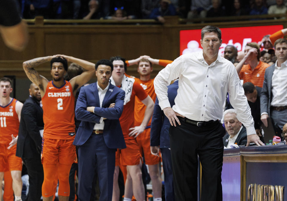 Clemson head coach Brad Brownell, front right, looks toward the court after a foul call sent Duke's Tyrese Proctor to the foul line during the final seconds of an NCAA college basketball game in Durham, N.C., Saturday, Jan. 27, 2024. (AP Photo/Ben McKeown)