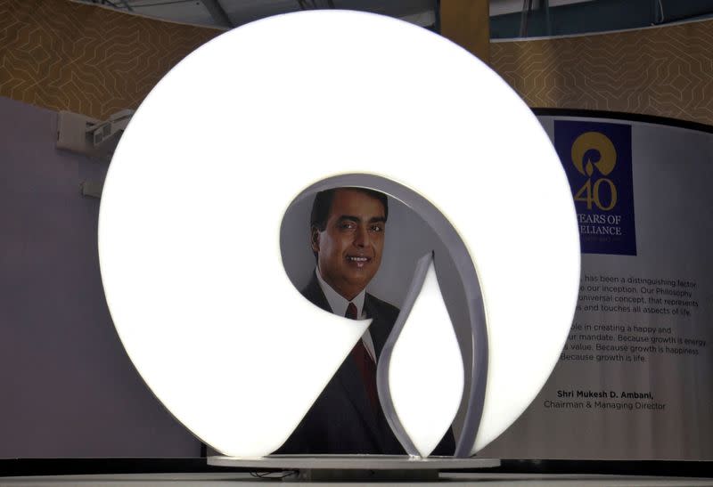 FILE PHOTO: The logo of Reliance Industries is pictured in a stall at the Vibrant Gujarat Global Trade Show at Gandhinagar