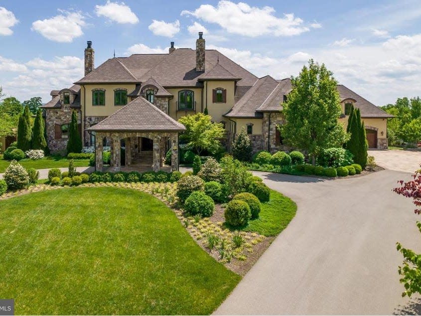 Mansion with lawn out front and long driveway in West Virginia