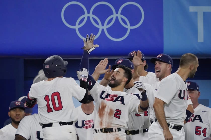 United States' Nick Allen celebrates with teammates after hitting a home run in the fifth inning of a baseball game against South Korea at the 2020 Summer Olympics, Saturday, July 31, 2021, in Yokohama, Japan. (AP Photo/Sue Ogrocki)