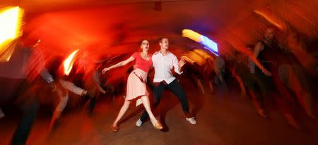 Swing dance teachers perform at "Claerchens Ballhaus" in Berlin, Germany, August 31, 2016. Claerchens Ballhaus first opened over 100 years ago, and for some 90 years it was run by the same family. Much of the decor still has an antique, untouched look. REUTERS/Hannibal Hanschke