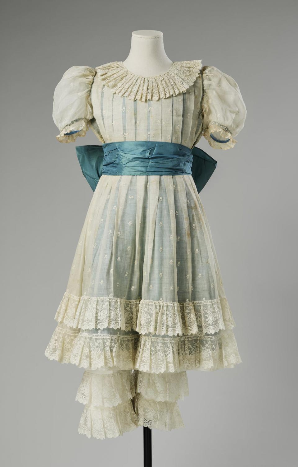 The blue taffeta dress overlaid with cream lace and matching cream lace bloomers worn by Princess Margaret to play The Hon. Lucinda Fairfax (Royal Collection/PA) (PA Media)