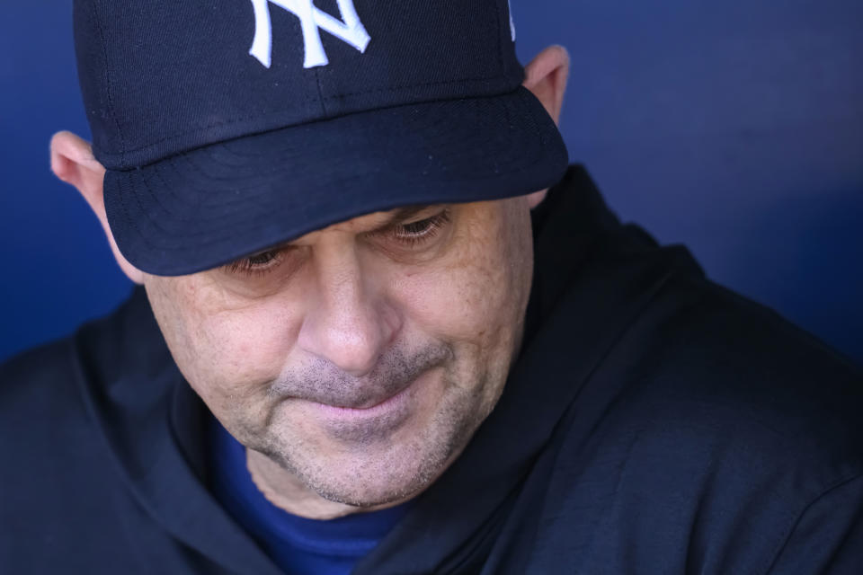 New York Yankees manager Aaron Boone answers questions from the media during warmups before a baseball game against the Kansas City Royals, Sunday, Oct. 1, 2023, in Kansas City, Mo. (AP Photo/Reed Hoffmann)