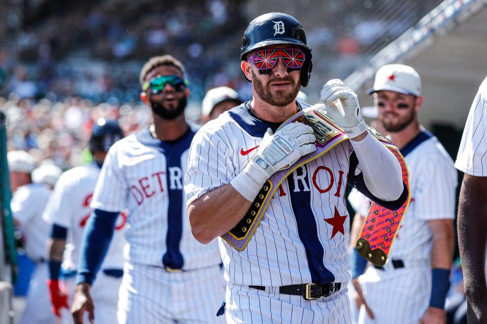 Detroit Tigers left fielder Robbie Grossman (8) celebrates a home run against the Texas Rangers during the first inning at Comerica Park in Detroit on Saturday, June 18, 2022.