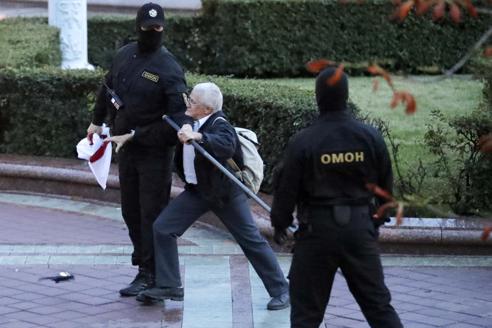 Police detain a protester during a Belarusian opposition supporters rally at Independence Square in Minsk, Belarus, Wednesday, Aug. 26, 2020. Protests demanding the resignation of Belarus' authoritarian President Alexander Lukashenko have entered their 18th straight day on Wednesday. (AP Photo/Sergei Grits)