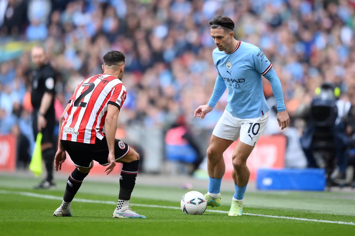 Jack Grealish takes on George Baldock of Sheffield United (The FA via Getty Images)