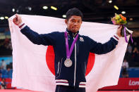 LONDON, ENGLAND - JULY 28: Hiroaki Hiraoka of Japan celebrates winning the silver medal in the Men's -60 kg Judo on Day 1 of the London 2012 Olympic Games at ExCeL on July 28, 2012 in London, England. (Photo by Alexander Hassenstein/Getty Images)