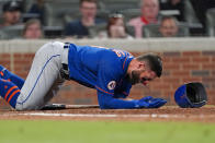 New York Mets' Kevin Pillar (11) tries to get to his feet after being hit in the face with a pitch from Atlanta Braves pitcher Jacob Webb in the seventh inning of a baseball game Monday, May 17, 2021, in Atlanta. (AP Photo/John Bazemore)