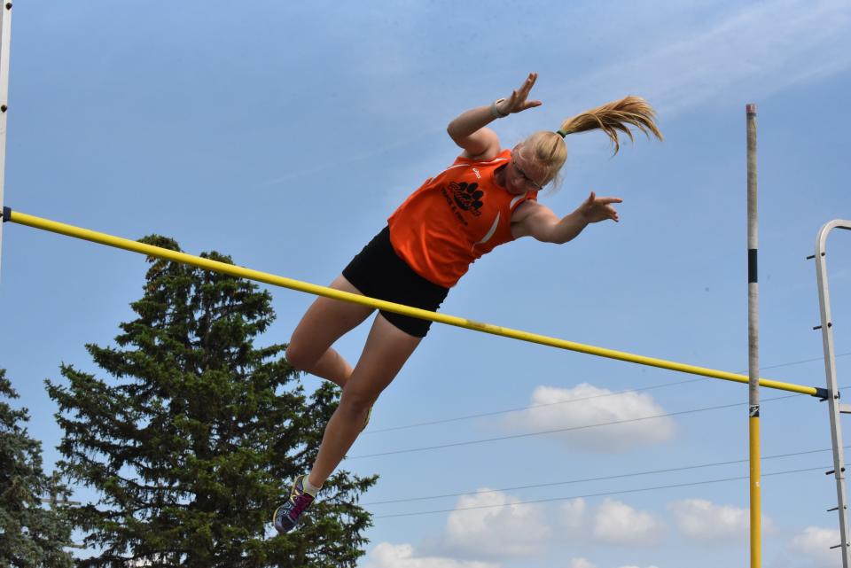 Hudson's Emily Czeisperger competes in the pole vault at the Lenawee County Track and Field Championships at Onsted.
