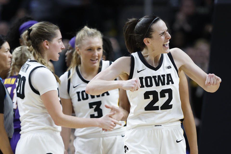 Iowa's celebrates with teammates during the Hawkeyes' win over LSU on Monday. (Sarah Stier/Getty Images)