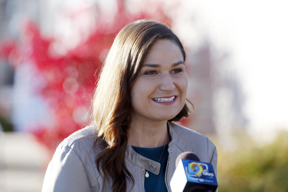 FILE - In this Nov. 3, 2020 file photo, Abby Finkenauer talks with journalists at the Linn County Democrats' office in Cedar Rapids, Iowa. Democrat Abby Finkenauer, a former congresswoman, is running for Republican Chuck Grassley's U.S. Senate seat, hoping her blue-collar credentials will propel her forward in a state that has grown more conservative over the years. (Liz Martin/The Gazette via AP)