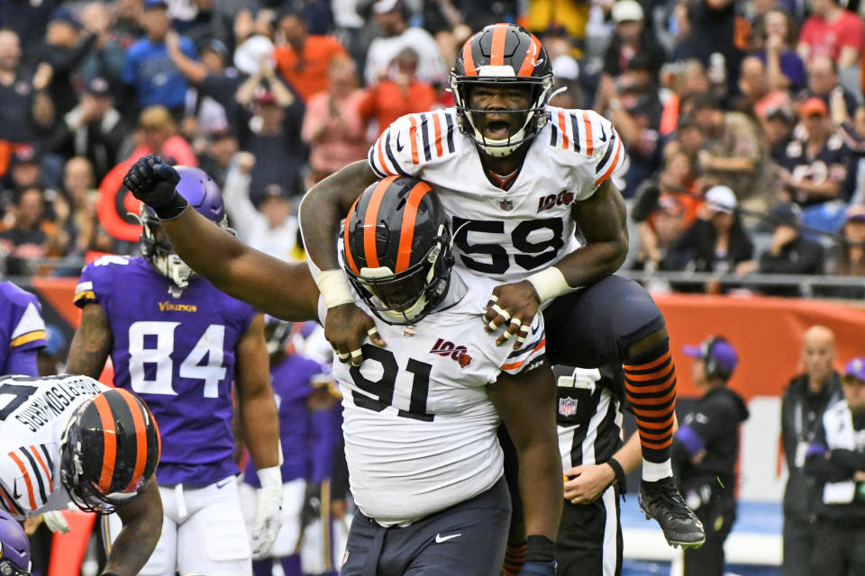 Chicago Bears' Danny Trevathan (59) and Eddie Goldman (91) celebrate a fumble by Minnesota Vikings quarterback Kirk Cousins and Bears recovery during the second half of an NFL football game Sunday, Sept. 29, 2019, in Chicago. (AP Photo/Matt Marton)