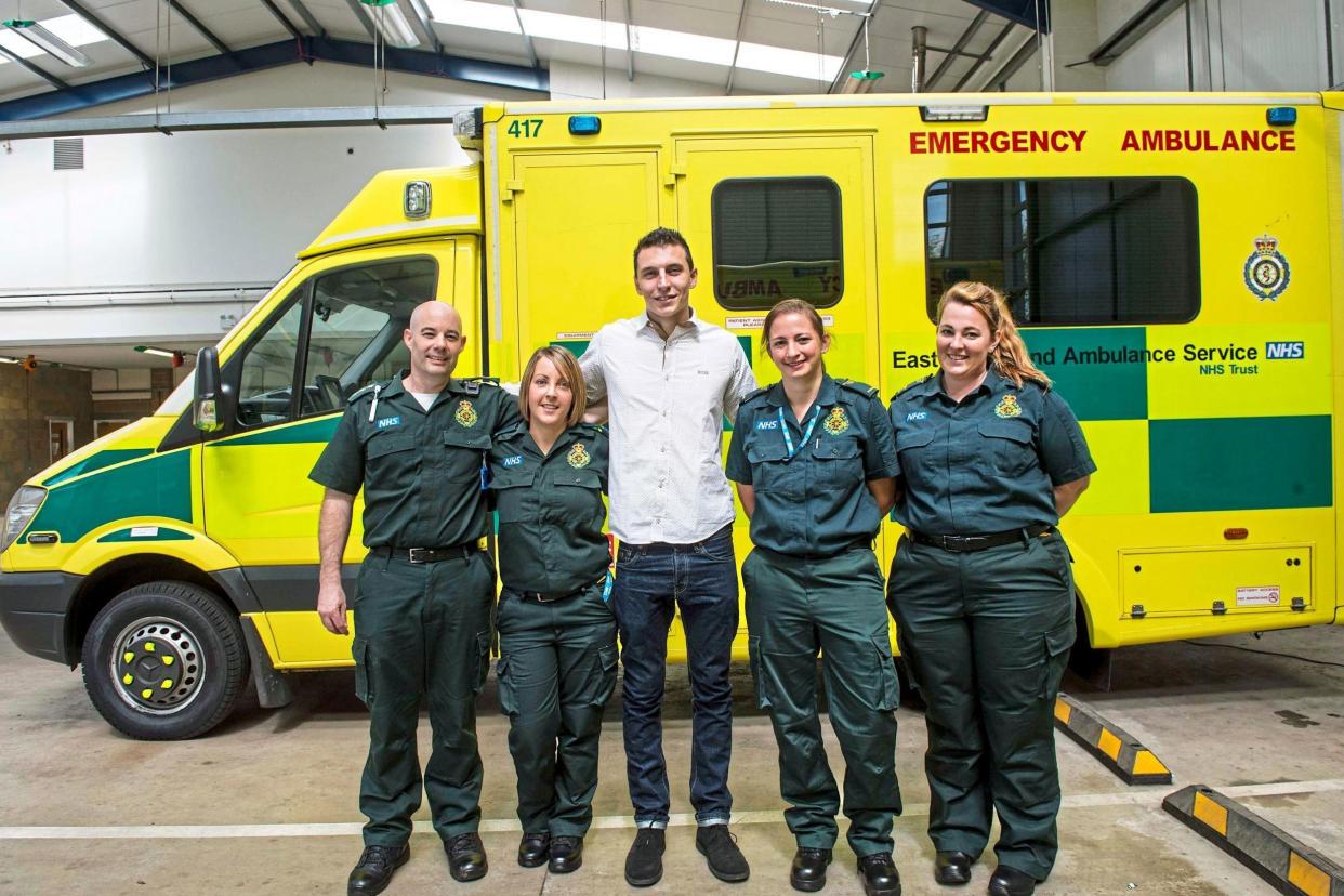 Emotional moment: Storm Warner with, from left, paramedics Phil Smith, Julia Horswell, Laura Wallace and Emily Wallis