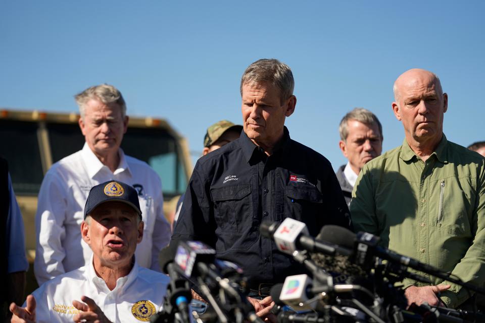 Tennessee Gov. Bill Lee, center, and Montana Gov. Greg Gianforte, right, stand with fellow governors as they listen to Texas Gov Greg Abbott, seated left, during a news conference along the Rio Grande to discuss Operation Lone Star and border concerns, Sunday, Feb. 4, 2024, in Eagle Pass, Texas.