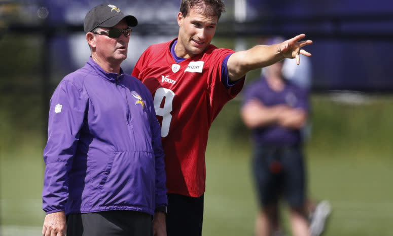 Minnesota Vikings head coach Mike Zimmer left and quarterback Kirk Cousins (8) went over a play during Minnesota Vikings training camp at TCO Performance center Saturday July 28, 2018 in Eagan, MN.