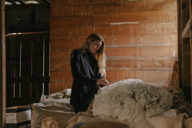 Maggie Hewitt at one of the farms where her label sources merino wool. Photo: Motion Sickness/Courtesy of Somewhere