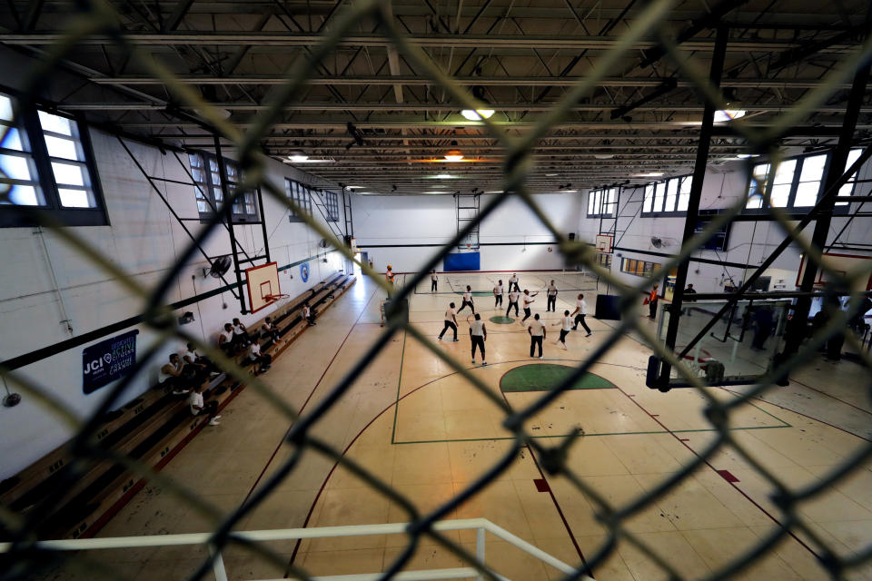 Detainees play volleyball in a gymnasium inside the Winn Correctional Center in Winnfield, La., Thursday, Sept. 26, 2019. (AP Photo/Gerald Herbert)