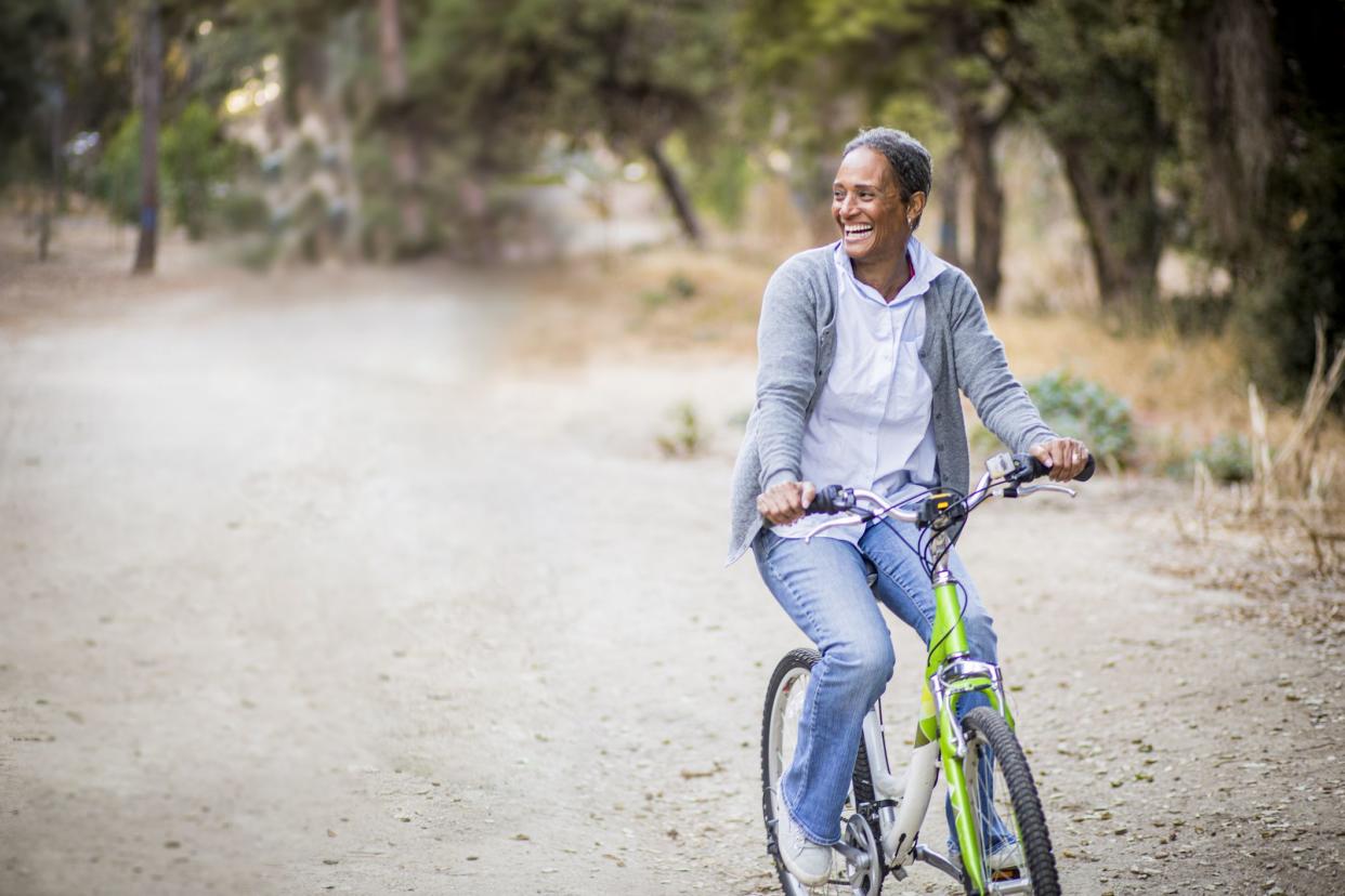 A senior African American Couple riding their bikes in nature