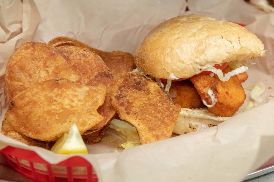 A Shrimp Po'Boy with homemade potato chips.