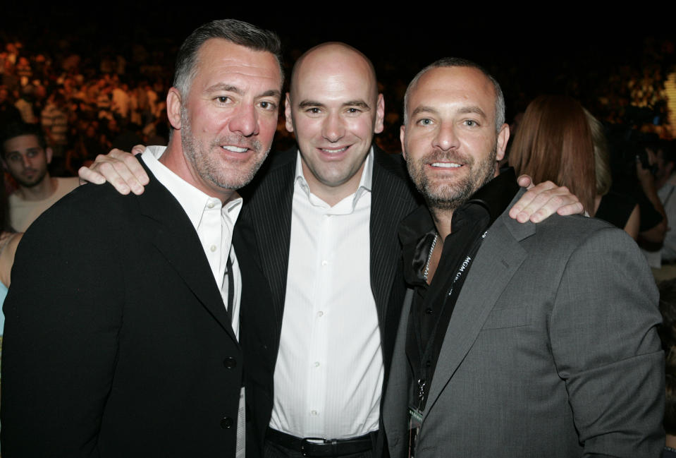 <p>It was a pivotal year behind the scenes, as casino magnates Frank (L) and Lorenzo Fertitta (R) bought the UFC, installed Dana White (C) as president, and were sanctioned in Nevada. But their coming-out show, UFC 33 in Las Vegas on Sept. 28, was memorable for all the wrong reasons, as all three title fights went to dull decisions and the PPV broadcast cut off before the show ended. (Associated Press) </p>