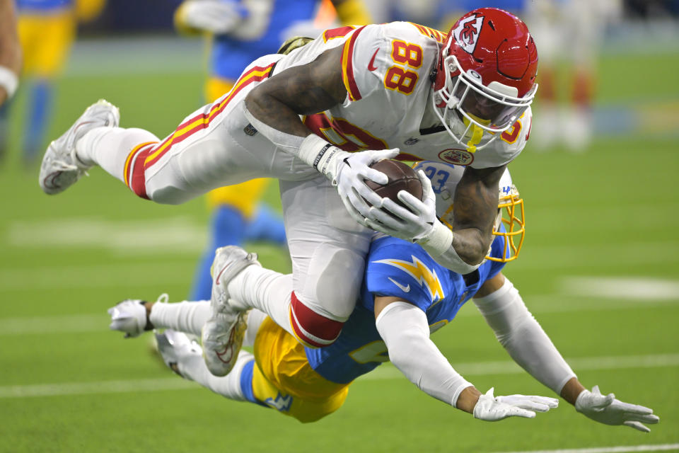 Kansas City Chiefs tight end Jody Fortson, top, makes a catch as Los Angeles Chargers cornerback Bryce Callahan defends during the first half of an NFL football game Sunday, Nov. 20, 2022, in Inglewood, Calif. (AP Photo/Jayne Kamin-Oncea)