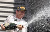 Belgium Formula One - F1 - Belgian Grand Prix 2016 - Francorchamps, Belgium - 28/8/16 - Mercedes' Nico Rosberg of Germany celebrates on the podium after the Belgian F1 Grand Prix. REUTERS/Yves Herman