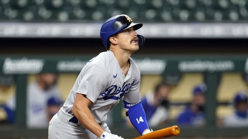 Los Angeles Dodgers' Enrique Hernandez watches his fly ball