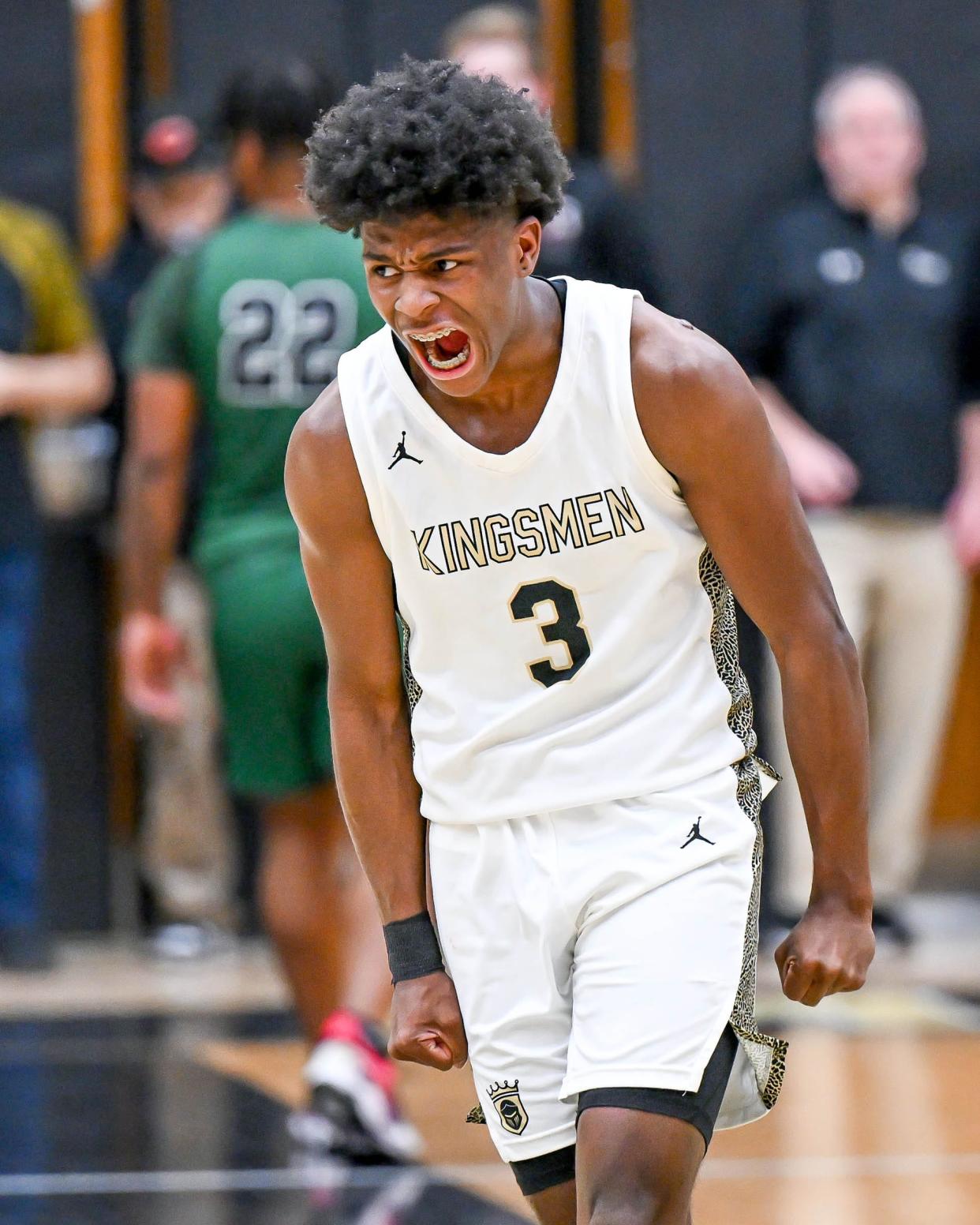 Penn's Markus Burton (3) reacts after a basket in the second half against Washington Friday, Feb. 10, 2023, at Penn High School. Penn won 85-51.