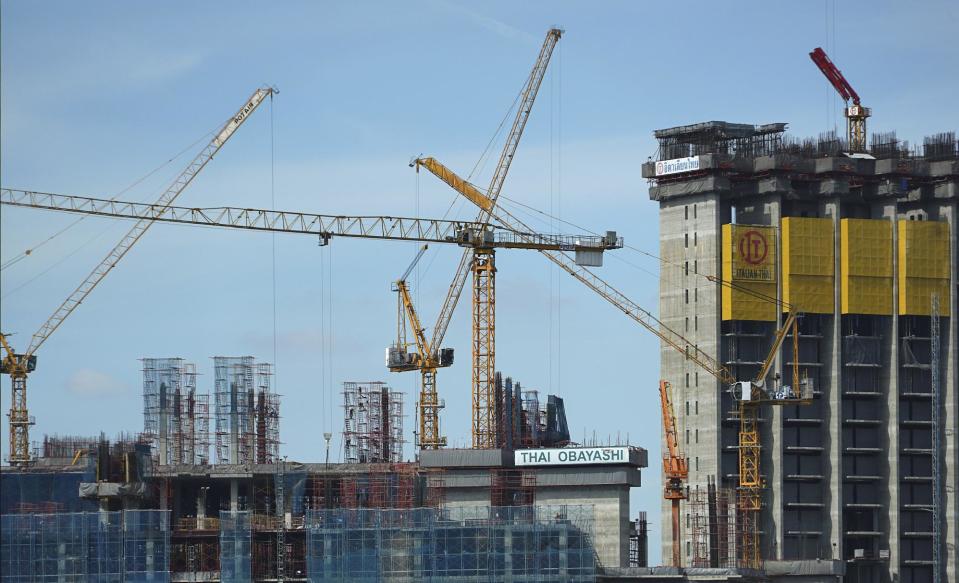 Massive construction projects are underway along the banks of the Chao Phraya river, Wednesday, Jan. 18, 2017, in Bangkok, Thailand. A United Nations report says Asia's economic outlook for 2017 is strong despite slowing global growth due to sluggish international trade and investment. (AP Photo/Dake Kang)