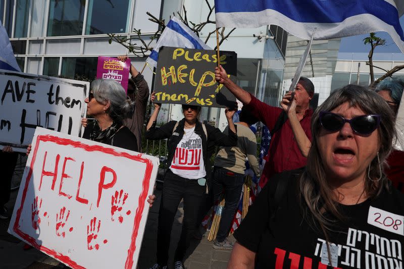 People protest on the day of a meeting between U.S. Secretary of State Blinken and Israeli President Herzog, in Tel Aviv